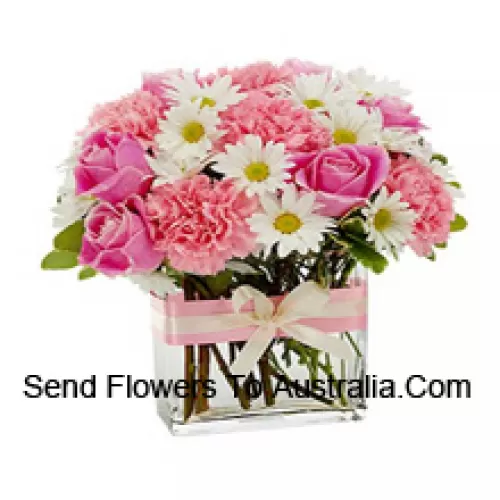 Pink Roses, Pink Carnations And Assorted White Seasonal Flowers Arranged Beautifully In A Glass Vase