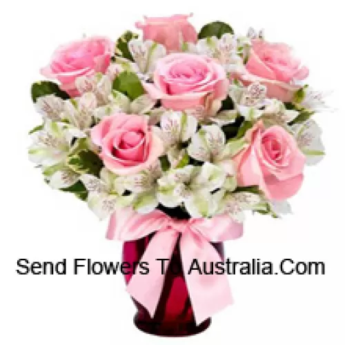 Pink Roses And White Alstroemeria Arrannged Beautifully In A Glass Vase