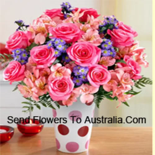 Pink Roses, Pink Orchids And Assorted Purple Flowers Arranged Beautifully In A Glass Vase