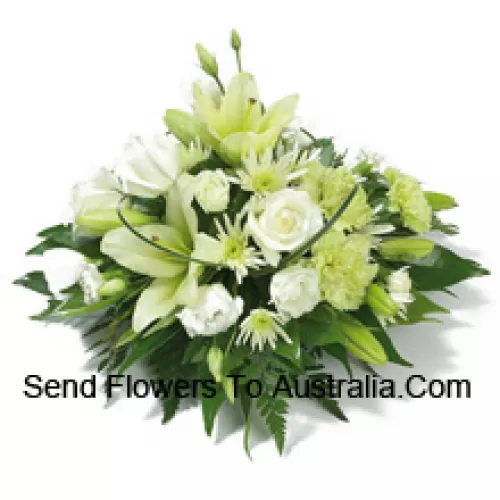 A Beautiful Arrangement Of White Roses, White Carnations, White Lilies And Assorted White Flowers With Seasonal Fillers