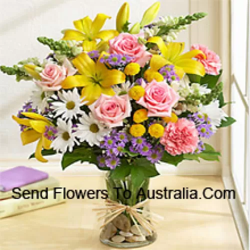 Pink Roses, Pink Carnations, White Gerberas And Yellow Lilies With Seasonal Fillers In A Glass Vase