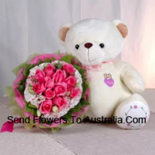 Bouquet aus 11 pinkfarbenen Rosen und einem mittelgroßen niedlichen Teddybär