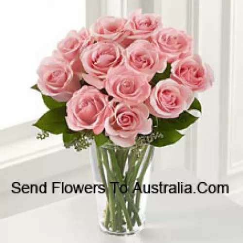 11 Pink Roses With Some Ferns In A Vase